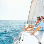 Young man and woman Relaxing on a Yacht.